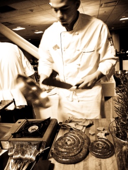 AURA Waterfront Restaurant chef prepares Chorizo 